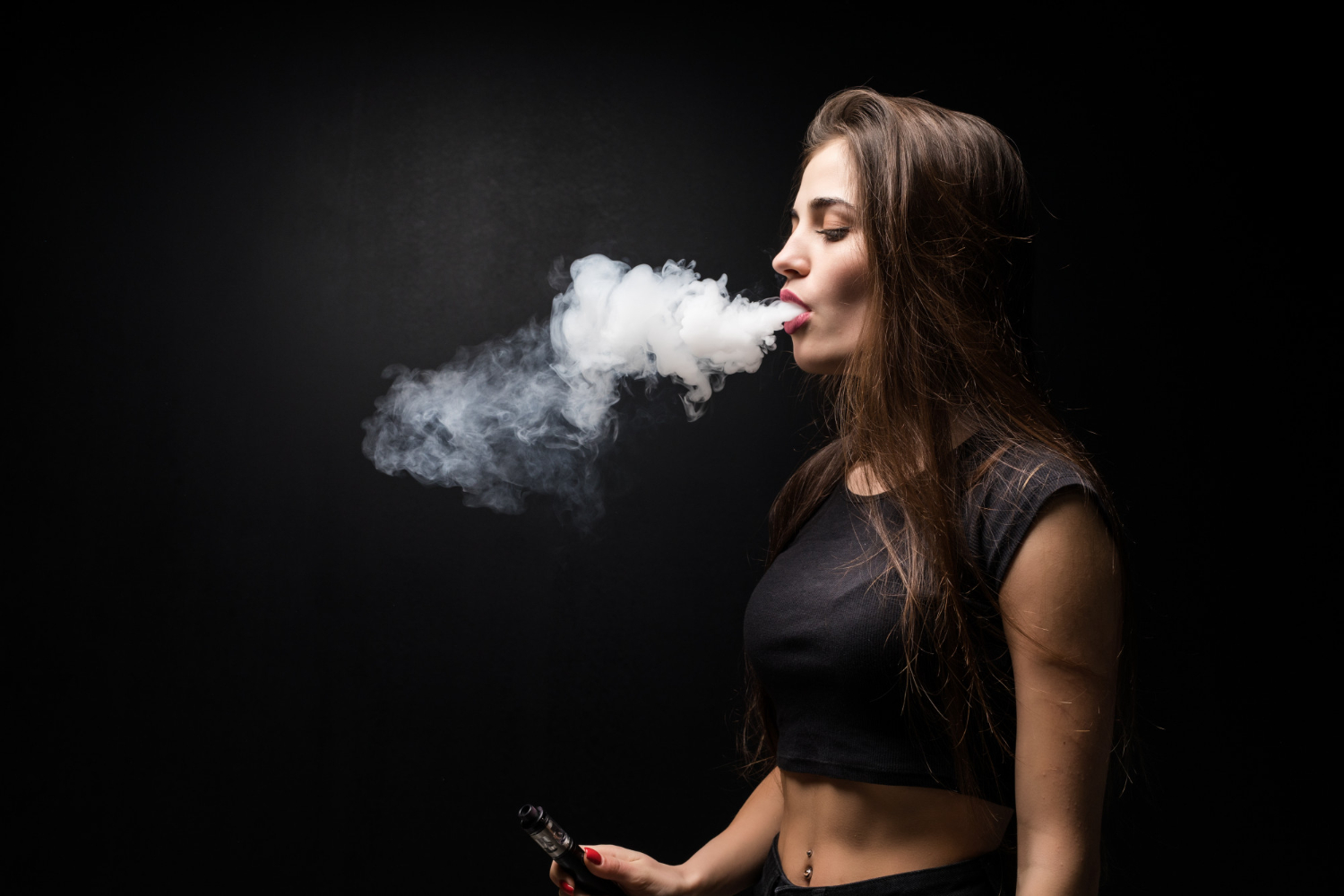 young-beautiful-woman-vaping-e-cigarette-black-wall