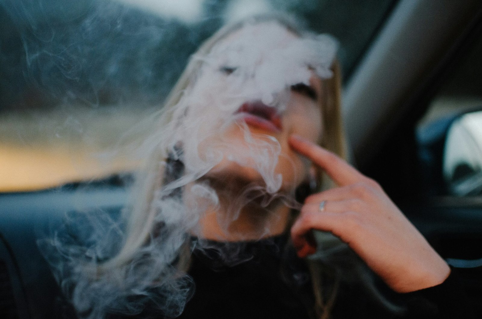 woman smoking in car